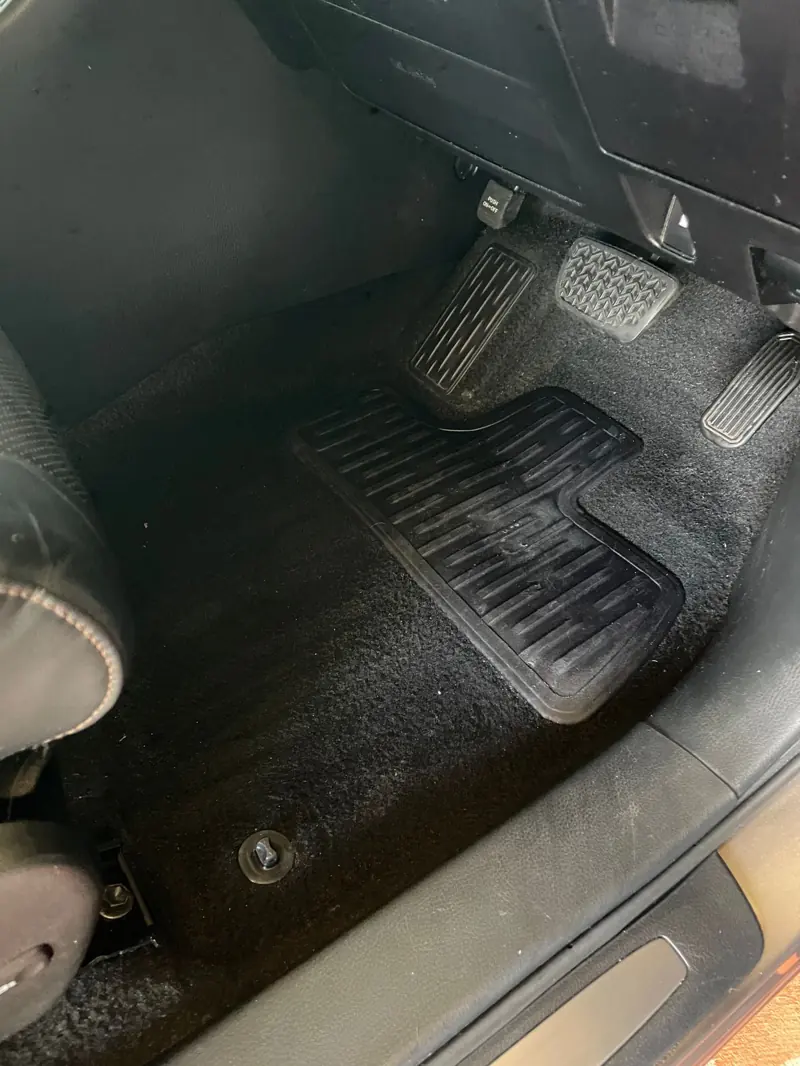 Car carpet cleaning: front floor carpet after detailing