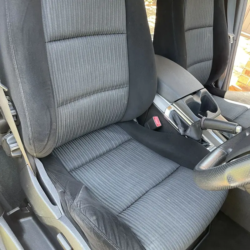 Car seat steam cleaning: cloth front seat after cleaning