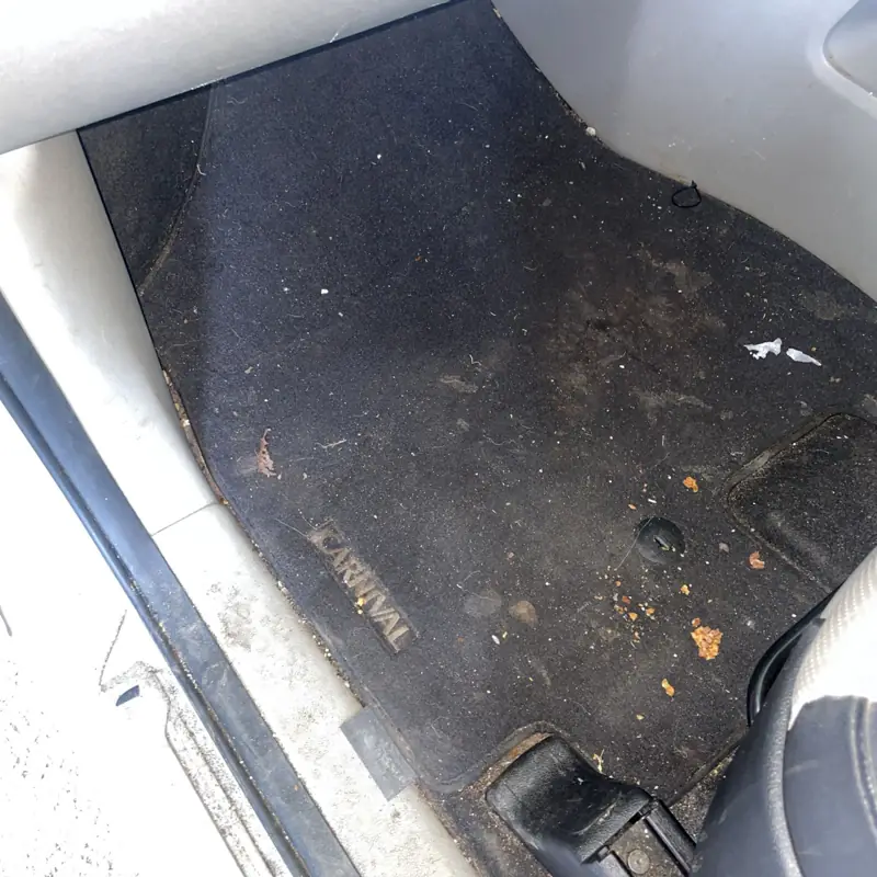 Car detailing in Chatswood: dirty boot floor before vacuuming