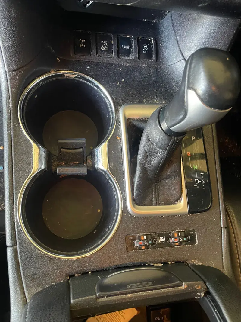 Car detailing in Bradbury: dirty cup holders before cleaning