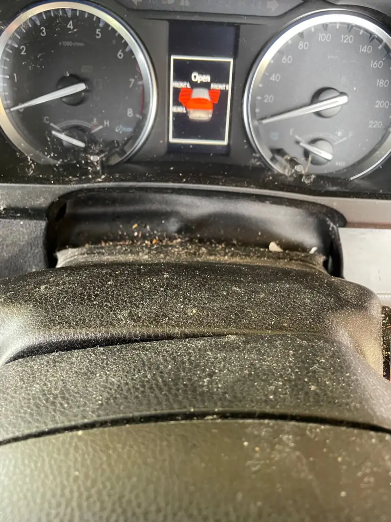 Car detailing in St Clair: dusty dashboard before cleaning