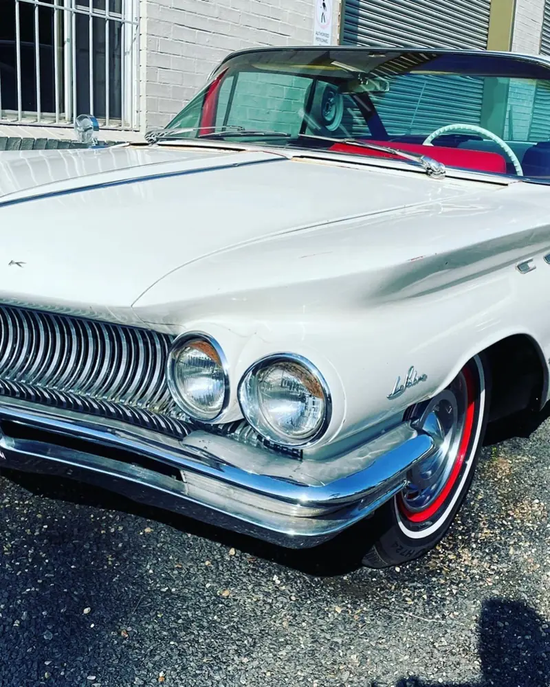 Ceramic coating in Gregory Hills: classic car with chrome and glossy white paint