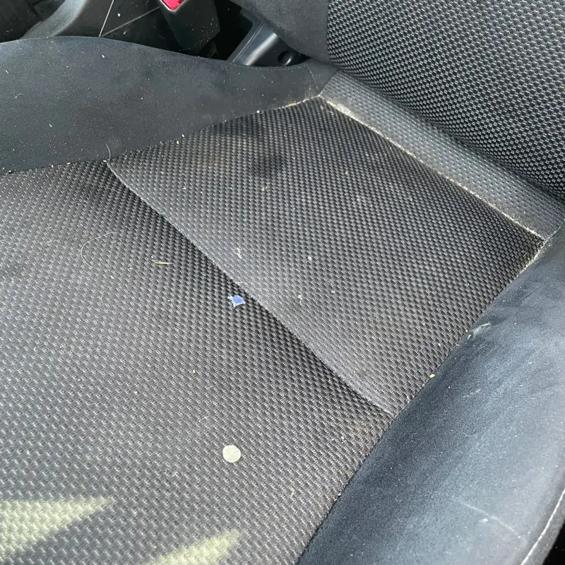 Car detailing in Mount Annan: stained cloth seat before shampooing